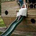 The bride goes down the slide first